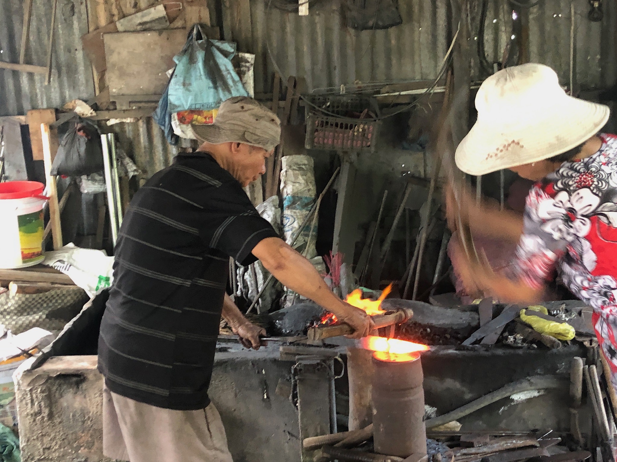  A husband and wife team running a small forge and making machetes in the Mekong Delta