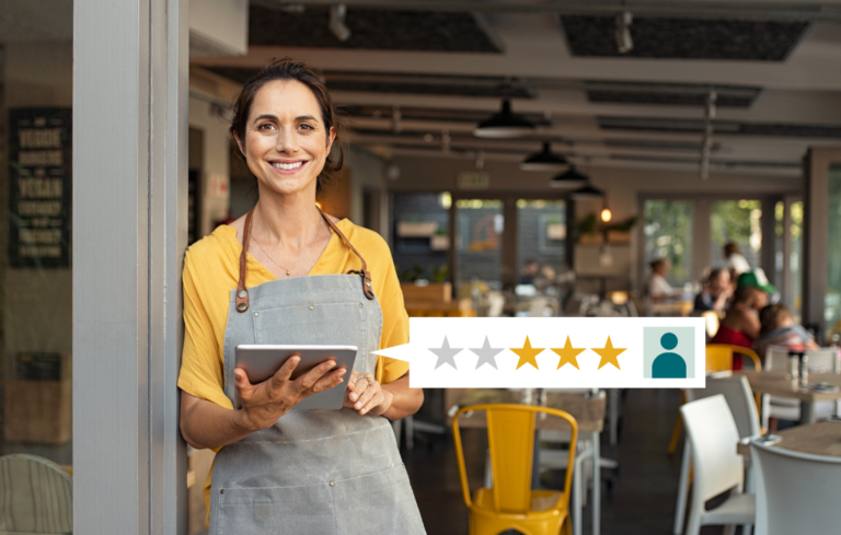 small business owner holding tablet for customer reviews